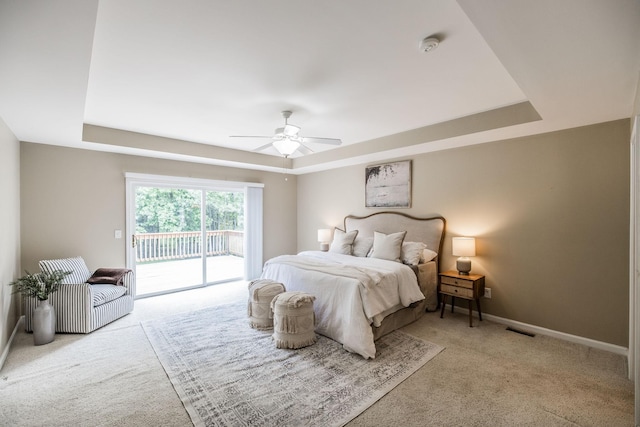 3505 Grove Park Dr, College Grove, TN 37046 - bedroom featuring a raised ceiling, access to exterior, carpet flooring, and baseboards