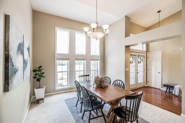 3505 Grove Park Dr, College Grove, TN 37046 - carpeted dining space featuring a chandelier, baseboards, and high vaulted ceiling