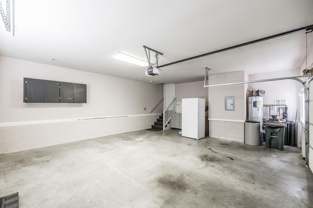 3505 Grove Park Dr, College Grove, TN 37046 - garage with electric panel, a garage door opener, and water heater