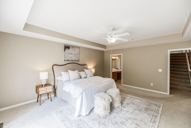3505 Grove Park Dr, College Grove, TN 37046 - carpeted bedroom with a tray ceiling, baseboards, and a ceiling fan