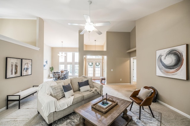 3505 Grove Park Dr, College Grove, TN 37046 - living area with carpet flooring, baseboards, high vaulted ceiling, a ceiling fan, and a chandelier