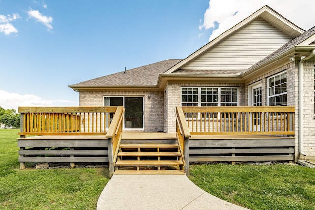 3505 Grove Park Dr, College Grove, TN 37046 - back of property featuring brick siding, a wooden deck, a shingled roof, and a lawn