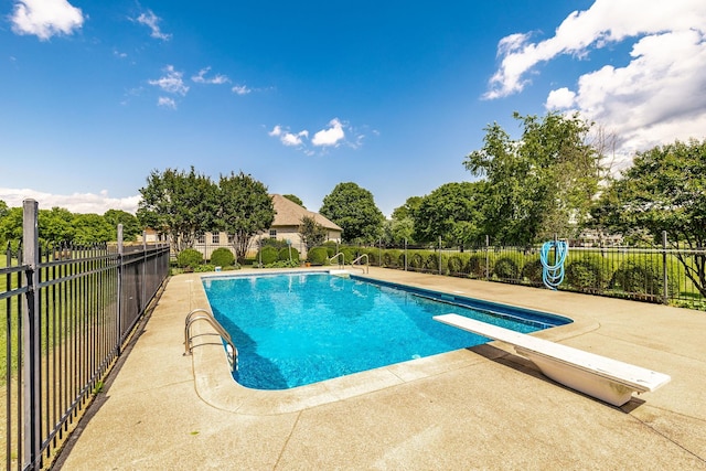 3505 Grove Park Dr, College Grove, TN 37046 - view of pool featuring a patio area, a diving board, and view of wooded area