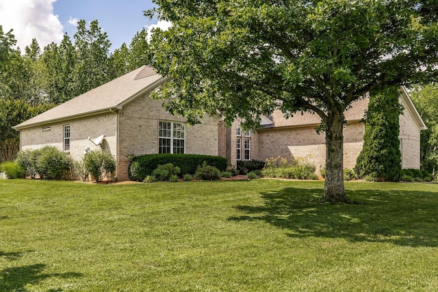 3505 Grove Park Dr, College Grove, TN 37046 - view of front of house with brick siding, a front lawn, and a shingled roof