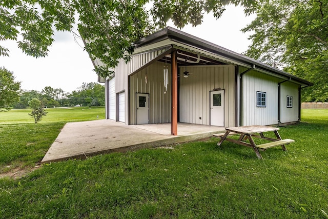 3505 Grove Park Dr, College Grove, TN 37046 - rear view of property with a detached garage, a yard, ceiling fan, and a patio