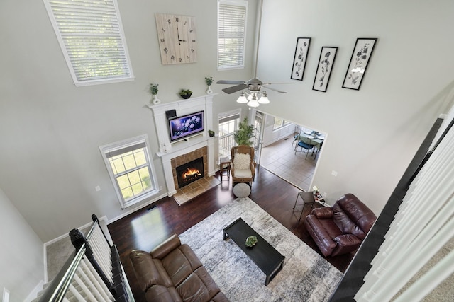 4702 Garcia Blvd, Murfreesboro, TN 37128 - living area featuring a high ceiling, healthy amount of natural light, wood finished floors, a ceiling fan, and a fireplace