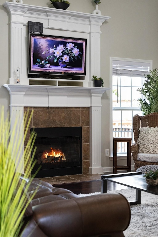 4702 Garcia Blvd, Murfreesboro, TN 37128 - living room featuring a tile fireplace, wood finished floors, and baseboards