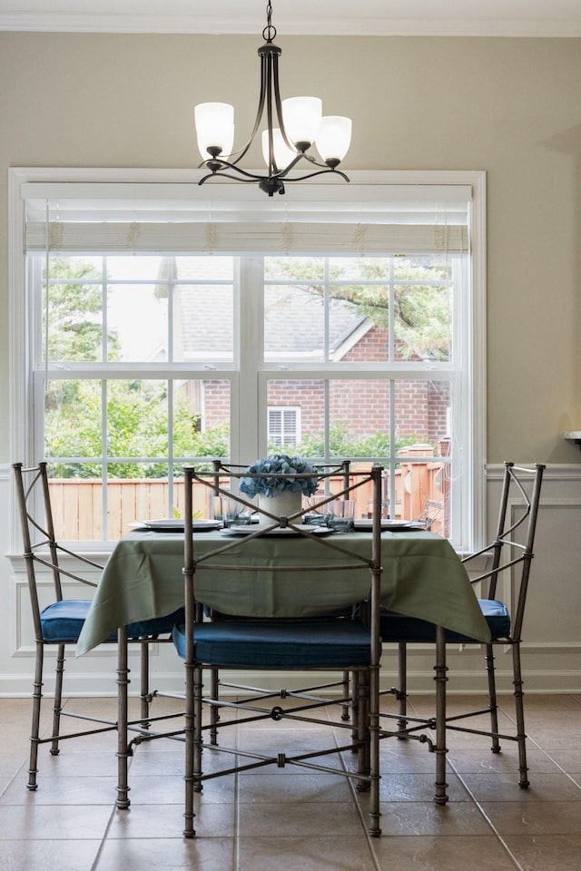 4702 Garcia Blvd, Murfreesboro, TN 37128 - dining area with ornamental molding, a chandelier, and a wainscoted wall