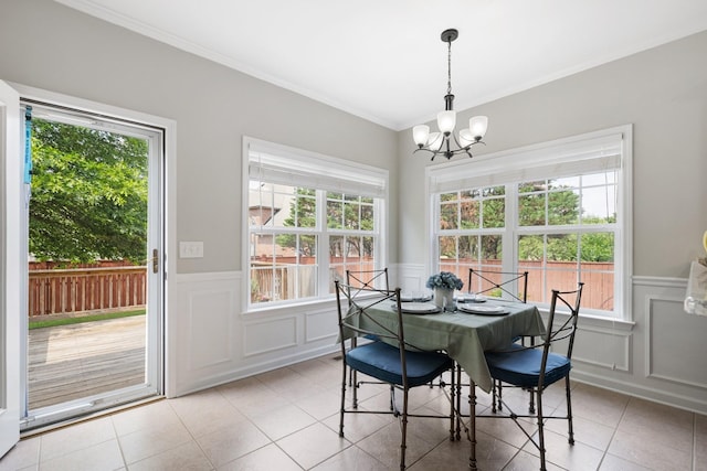4702 Garcia Blvd, Murfreesboro, TN 37128 - dining area with a decorative wall, a chandelier, wainscoting, plenty of natural light, and light tile patterned floors