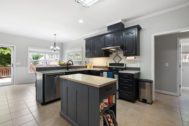 4702 Garcia Blvd, Murfreesboro, TN 37128 - kitchen with stainless steel appliances, wooden counters, a sink, a peninsula, and under cabinet range hood