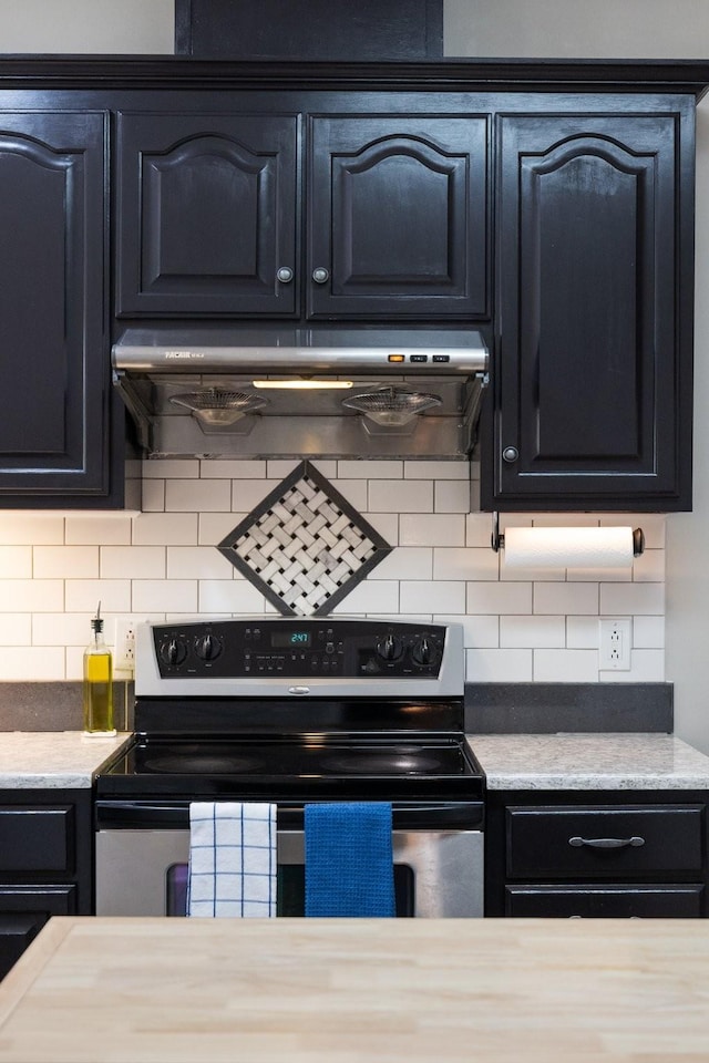 4702 Garcia Blvd, Murfreesboro, TN 37128 - kitchen featuring stainless steel electric stove, decorative backsplash, and dark cabinetry