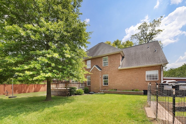4702 Garcia Blvd, Murfreesboro, TN 37128 - rear view of property featuring a shingled roof, brick siding, and a wooden deck