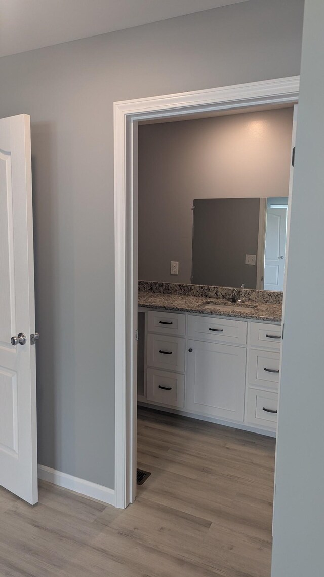 171 Ashmore Rd, Summertown, TN 38483 - bathroom featuring vanity, wood finished floors, and baseboards