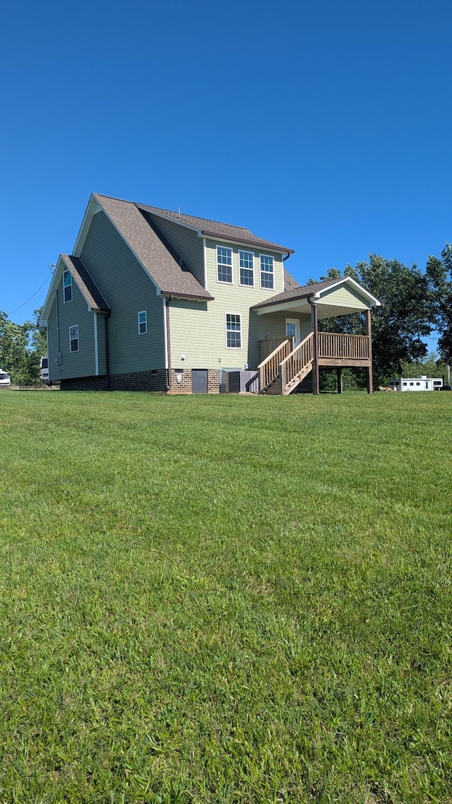 171 Ashmore Rd, Summertown, TN 38483 - rear view of property featuring a lawn, stairway, central AC, and roof with shingles