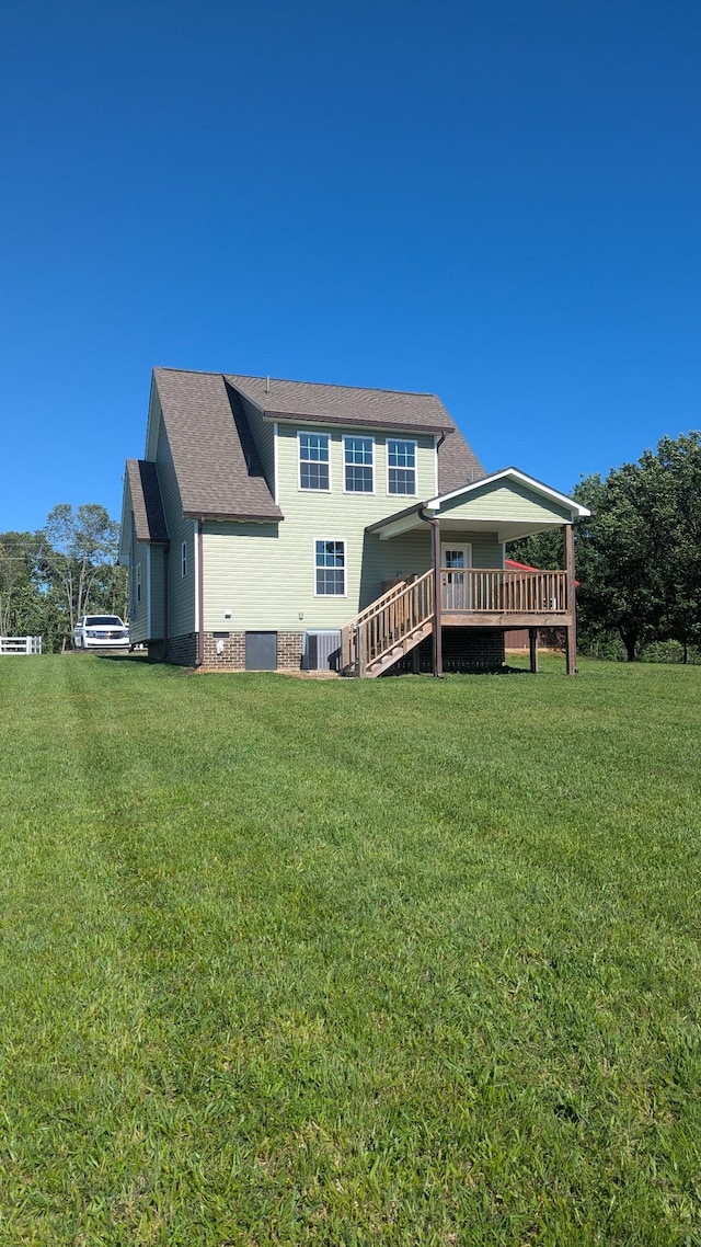 171 Ashmore Rd, Summertown, TN 38483 - rear view of house with a lawn, cooling unit, a deck, and a shingled roof