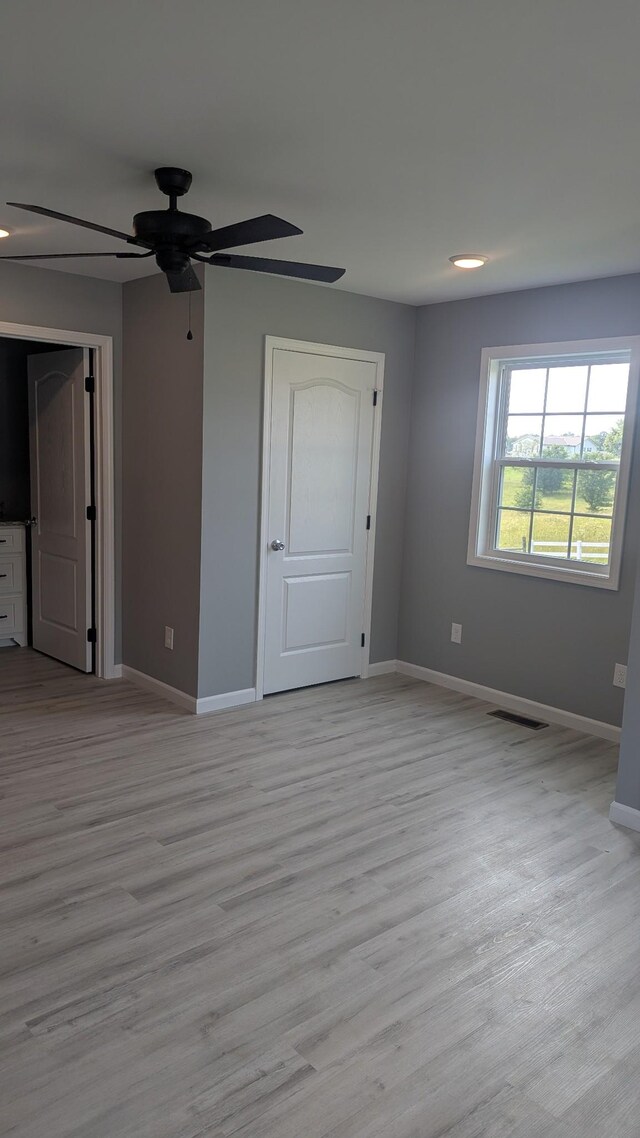 171 Ashmore Rd, Summertown, TN 38483 - unfurnished room with baseboards, ceiling fan, and light wood-style flooring