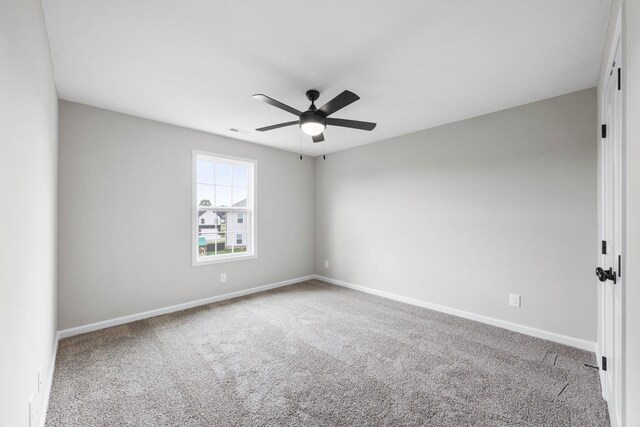2586 Rafiki Dr, Clarksville, TN 37042 - empty room featuring carpet flooring, ceiling fan, and baseboards