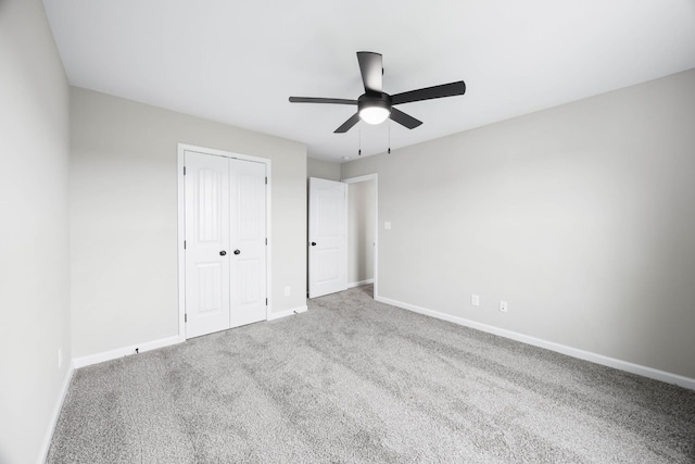 2586 Rafiki Dr, Clarksville, TN 37042 - unfurnished bedroom with baseboards, a closet, carpet, and a ceiling fan