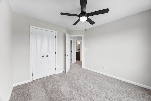 2586 Rafiki Dr, Clarksville, TN 37042 - unfurnished bedroom featuring carpet flooring, a closet, baseboards, and ceiling fan