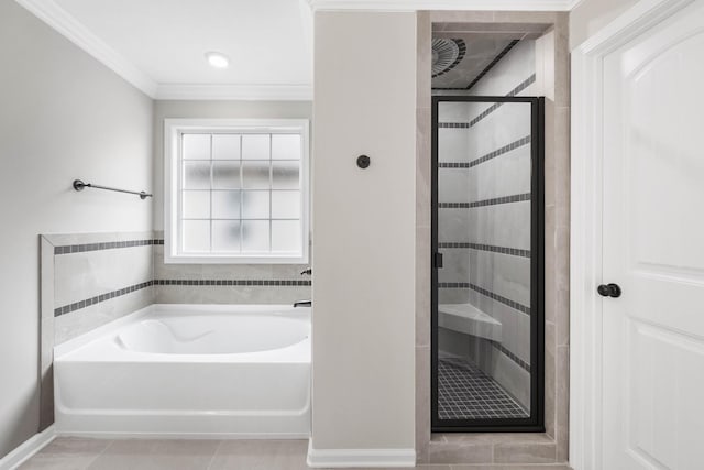 2586 Rafiki Dr, Clarksville, TN 37042 - bathroom with a bath, a stall shower, tile patterned floors, ornamental molding, and baseboards