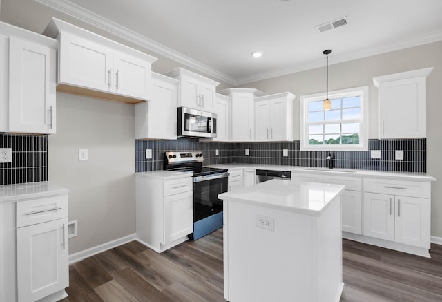 2586 Rafiki Dr, Clarksville, TN 37042 - kitchen featuring appliances with stainless steel finishes, a sink, crown molding, white cabinetry, and tasteful backsplash