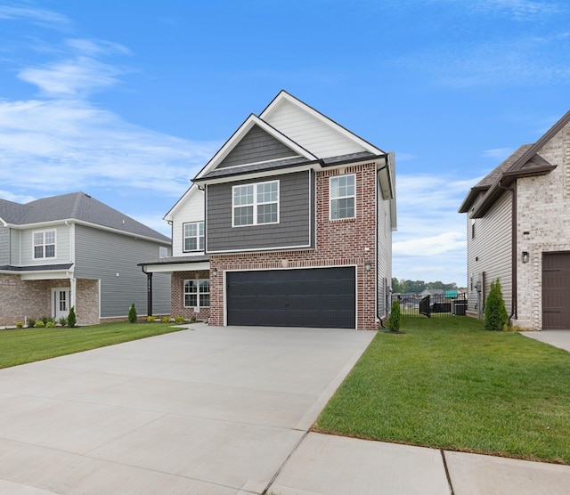 2586 Rafiki Dr, Clarksville, TN 37042 - view of front of property with brick siding, concrete driveway, and a garage