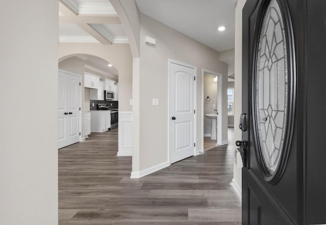 2586 Rafiki Dr, Clarksville, TN 37042 - foyer entrance featuring ornamental molding, dark wood-type flooring, recessed lighting, baseboards, and arched walkways