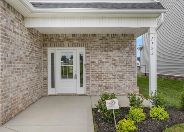 2582 Rafiki Dr, Clarksville, TN 37042 - entrance to property featuring a shingled roof and brick siding