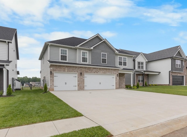 2582 Rafiki Dr, Clarksville, TN 37042 - view of front of house featuring brick siding, driveway, an attached garage, and a front lawn