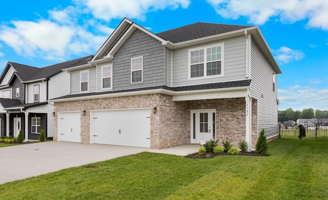 2582 Rafiki Dr, Clarksville, TN 37042 - view of front of home with brick siding, a garage, and driveway