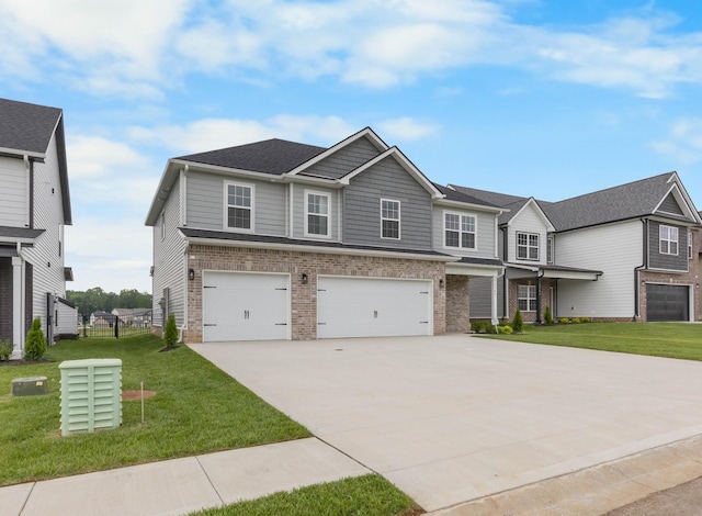 2582 Rafiki Dr, Clarksville, TN 37042 - view of front of property with brick siding, concrete driveway, an attached garage, and a front lawn