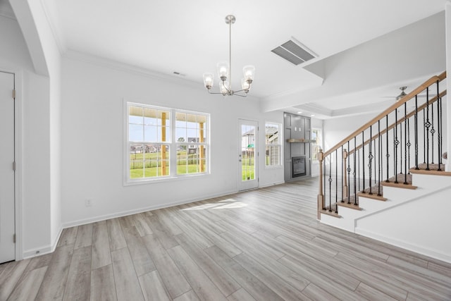 2582 Rafiki Dr, Clarksville, TN 37042 - entryway with ornamental molding, light wood-type flooring, a chandelier, stairs, and baseboards