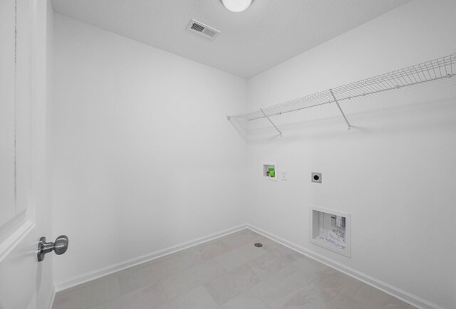2582 Rafiki Dr, Clarksville, TN 37042 - washroom with hookup for an electric dryer, washer hookup, and baseboards