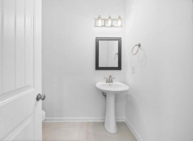 2582 Rafiki Dr, Clarksville, TN 37042 - bathroom featuring toilet, baseboards, and tile patterned flooring