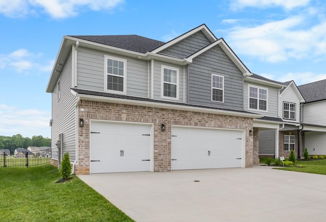 2582 Rafiki Dr, Clarksville, TN 37042 - view of front facade with a garage, driveway, roof with shingles, and brick siding