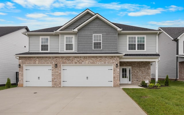 2582 Rafiki Dr, Clarksville, TN 37042 - craftsman-style home with brick siding, driveway, a garage, a front yard, and a shingled roof