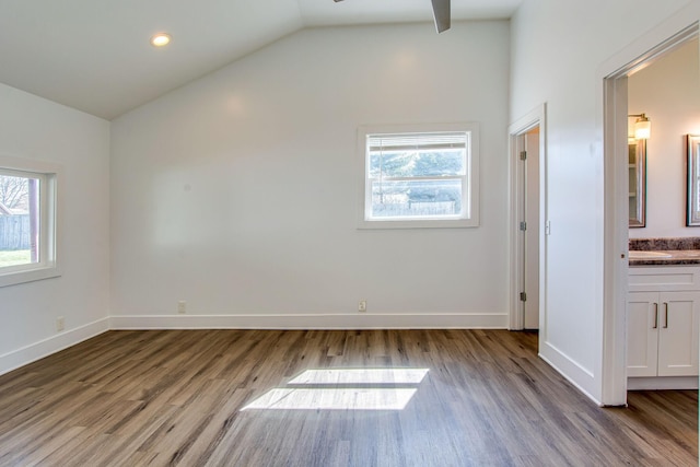 1655 Ben Johns Rd, Smyrna, TN 37167 - unfurnished bedroom featuring lofted ceiling, wood finished floors, baseboards, and ensuite bathroom