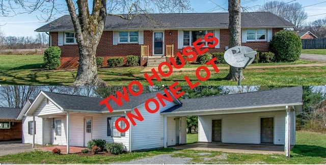 1655 Ben Johns Rd, Smyrna, TN 37167 - ranch-style home featuring entry steps, a carport, a front yard, and brick siding