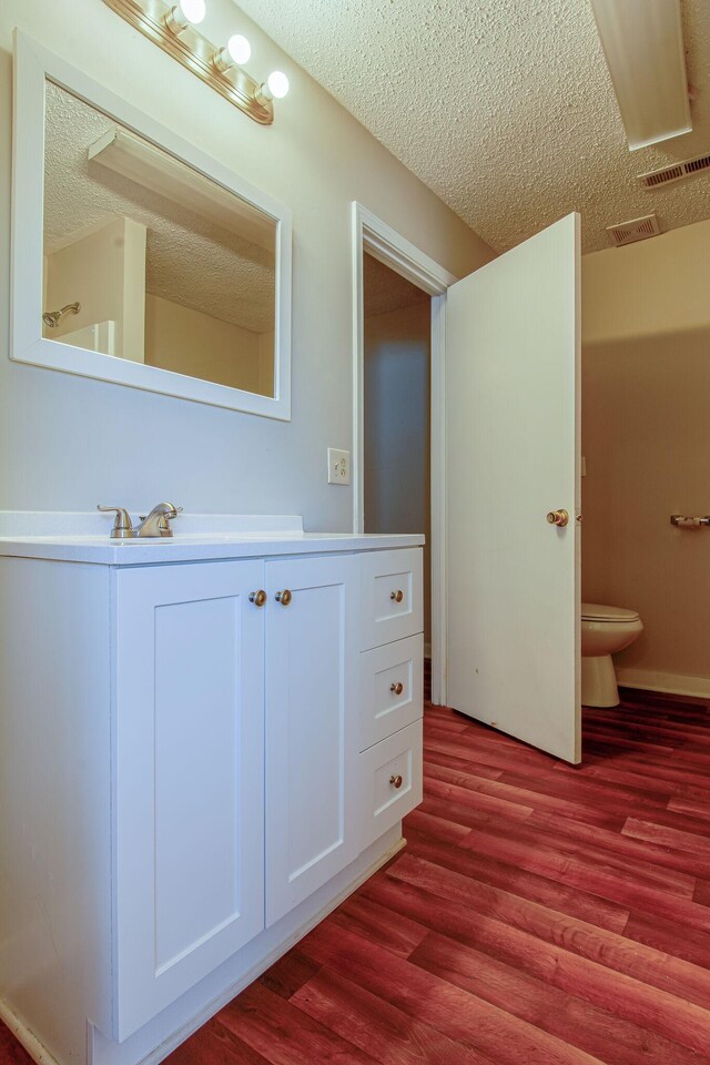 1655 Ben Johns Rd, Smyrna, TN 37167 - bathroom with toilet, wood finished floors, vanity, and a textured ceiling