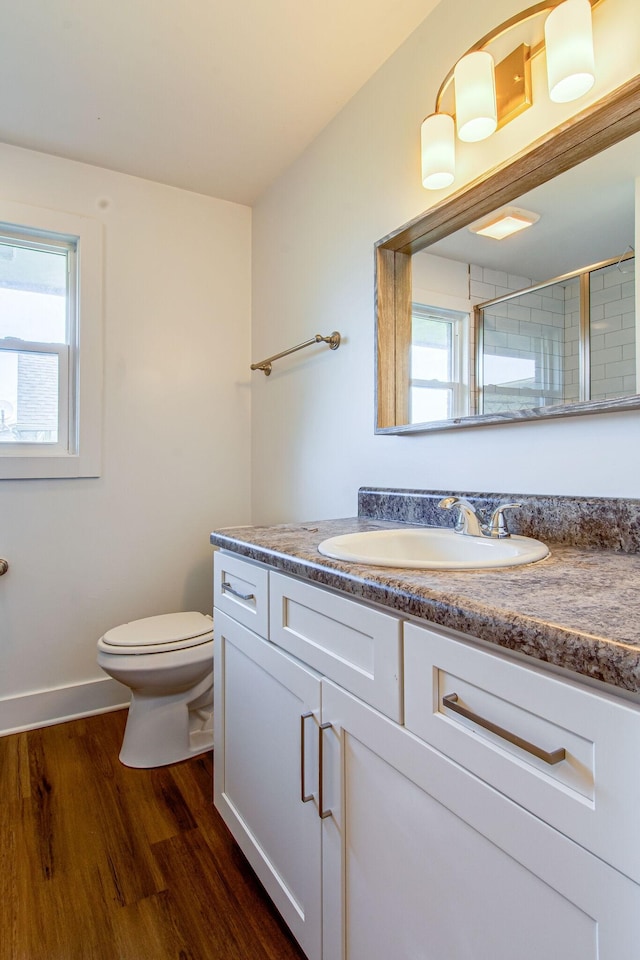 1655 Ben Johns Rd, Smyrna, TN 37167 - full bathroom with toilet, wood finished floors, vanity, a shower, and baseboards
