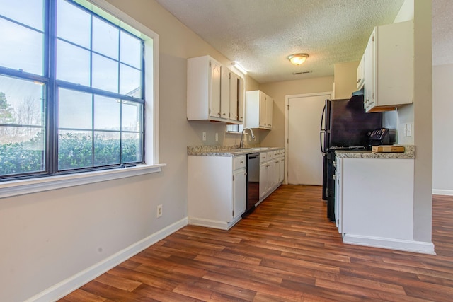 1655 Ben Johns Rd, Smyrna, TN 37167 - kitchen with dishwashing machine, dark wood finished floors, a sink, white cabinets, and baseboards