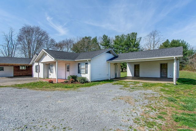 1655 Ben Johns Rd, Smyrna, TN 37167 - single story home with driveway, a porch, and a carport