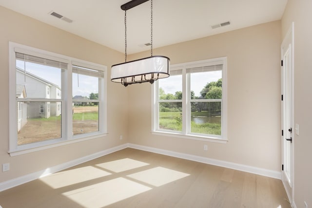 5962 Hunt Valley Dr, Spring Hill, TN 37174 - unfurnished dining area with wood finished floors and baseboards