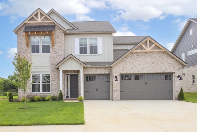 5962 Hunt Valley Dr, Spring Hill, TN 37174 - craftsman house with board and batten siding, a front lawn, driveway, and brick siding