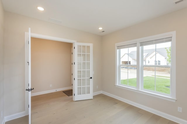 5962 Hunt Valley Dr, Spring Hill, TN 37174 - empty room with french doors, light wood-style floors, baseboards, and recessed lighting