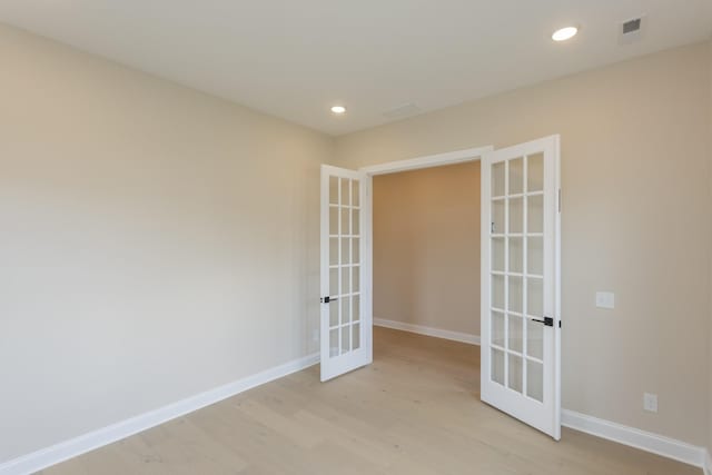 5962 Hunt Valley Dr, Spring Hill, TN 37174 - empty room with french doors, light wood finished floors, baseboards, and recessed lighting