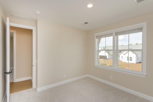 5962 Hunt Valley Dr, Spring Hill, TN 37174 - empty room featuring light colored carpet, baseboards, recessed lighting, and a smoke detector