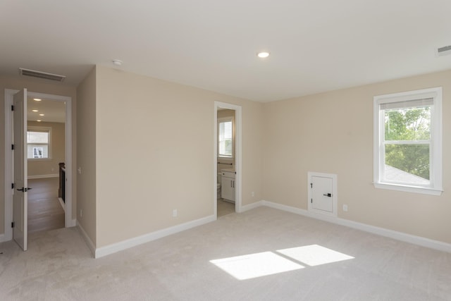 5962 Hunt Valley Dr, Spring Hill, TN 37174 - spare room featuring plenty of natural light, light colored carpet, baseboards, recessed lighting, and a smoke detector