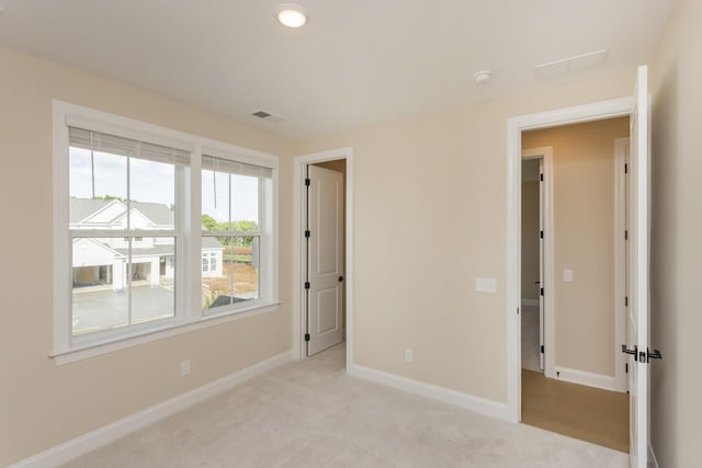 5962 Hunt Valley Dr, Spring Hill, TN 37174 - unfurnished bedroom with baseboards and light carpet