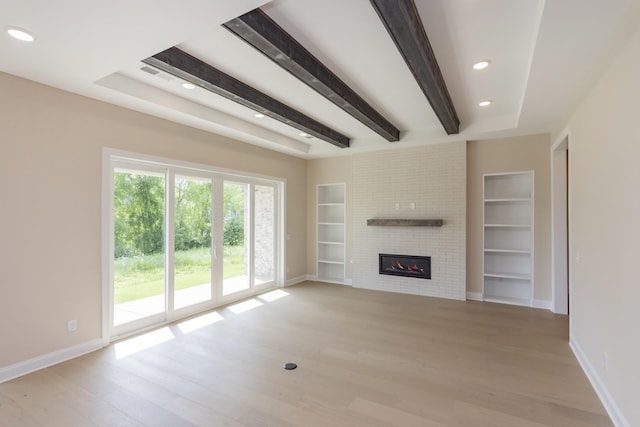 5962 Hunt Valley Dr, Spring Hill, TN 37174 - unfurnished living room with baseboards, light wood-type flooring, beamed ceiling, and recessed lighting